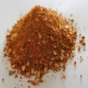 Red Desert Dust seasoning in a labeled jar, showcasing a rich, earthy blend of Australian native spices