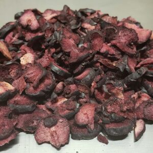 Jar of freeze-dried Illawarra plums, showcasing dark purple native Australian fruits used in sauces, desserts, and snacks